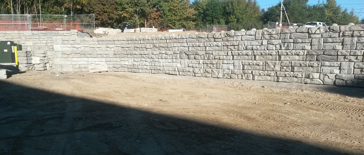 Redi-Rock Retaining wall being installed by J&R Precast at the Plainridge Park Casino.
